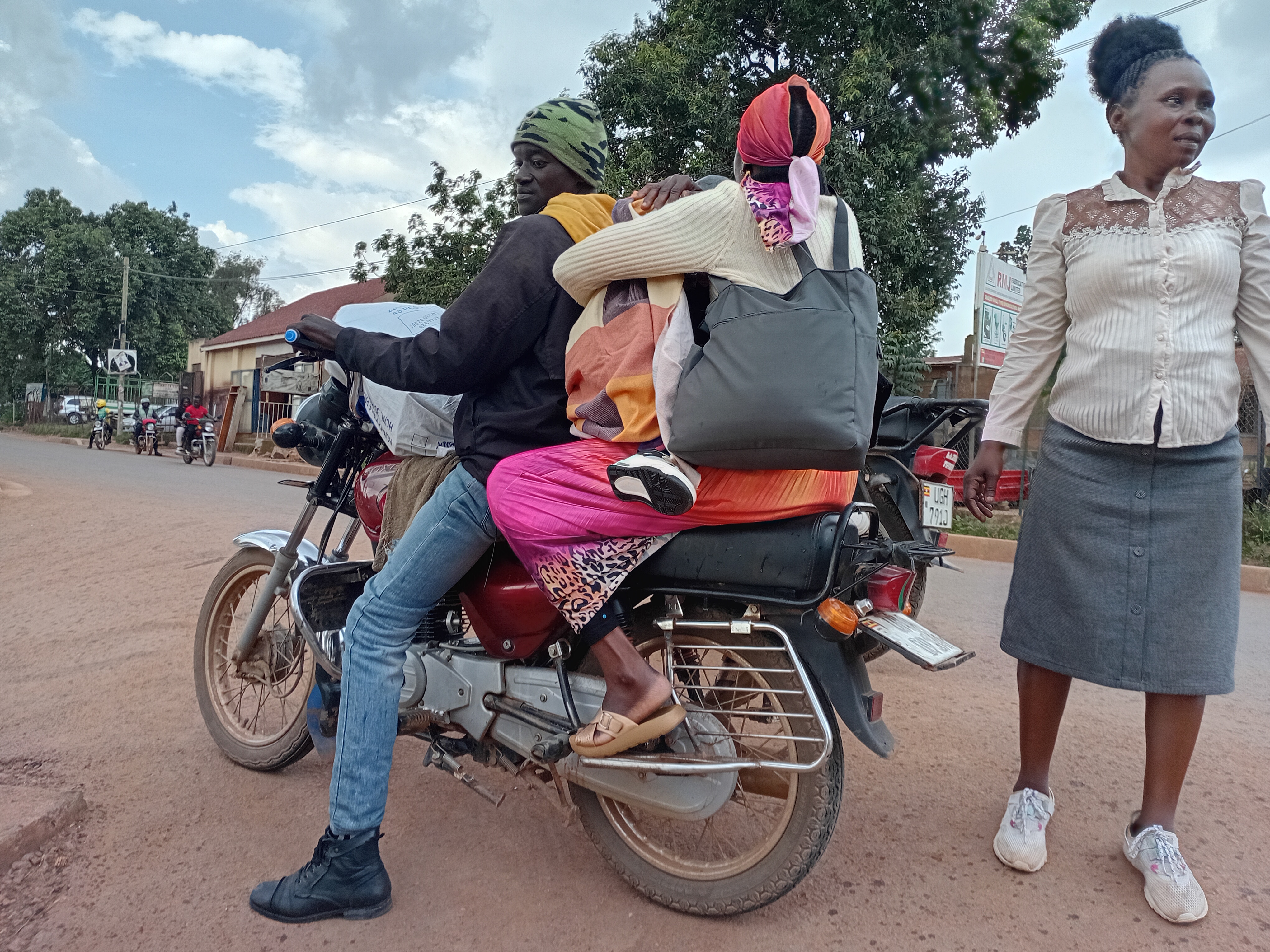 A caregiver and child head home after an outreach visit.